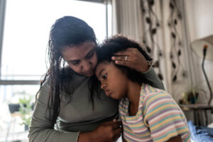 Parent comforting a young child experiencing anxiety in Alpharetta, GA