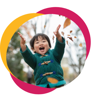 Photo of a small boy smiling and playing in leaves. With the help of child therapy in Hiram, GA your child can work with a skilled child therapist to overcome their struggles and manage life changes.