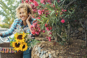 smiling woman by flowers | therapy in alpharetta, ga | emdr therapy in alpharetta, ga | trauma therapy in alpharetta, ga | trauma therapy in alpharetta, ga | grief counseling in alpharetta, ga | depression counseling in alpharetta, ga | 31210 | 30141 | 30005 Photo of a woman standing outside next to pink flowers and smiling. Looking for therapy to start coping with your mental health in a healthier way? With therapy in Alpharetta, GA you can begin working to start coping with your symptoms in a healthy way.