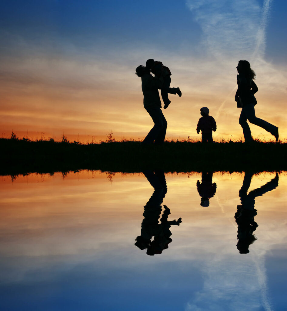 Photo of a family playing on the beach at sunset. If you or a member of your family are struggling with anxiety, discover how anxiety counseling in Macon, GA can help you begin to manage your symptoms.