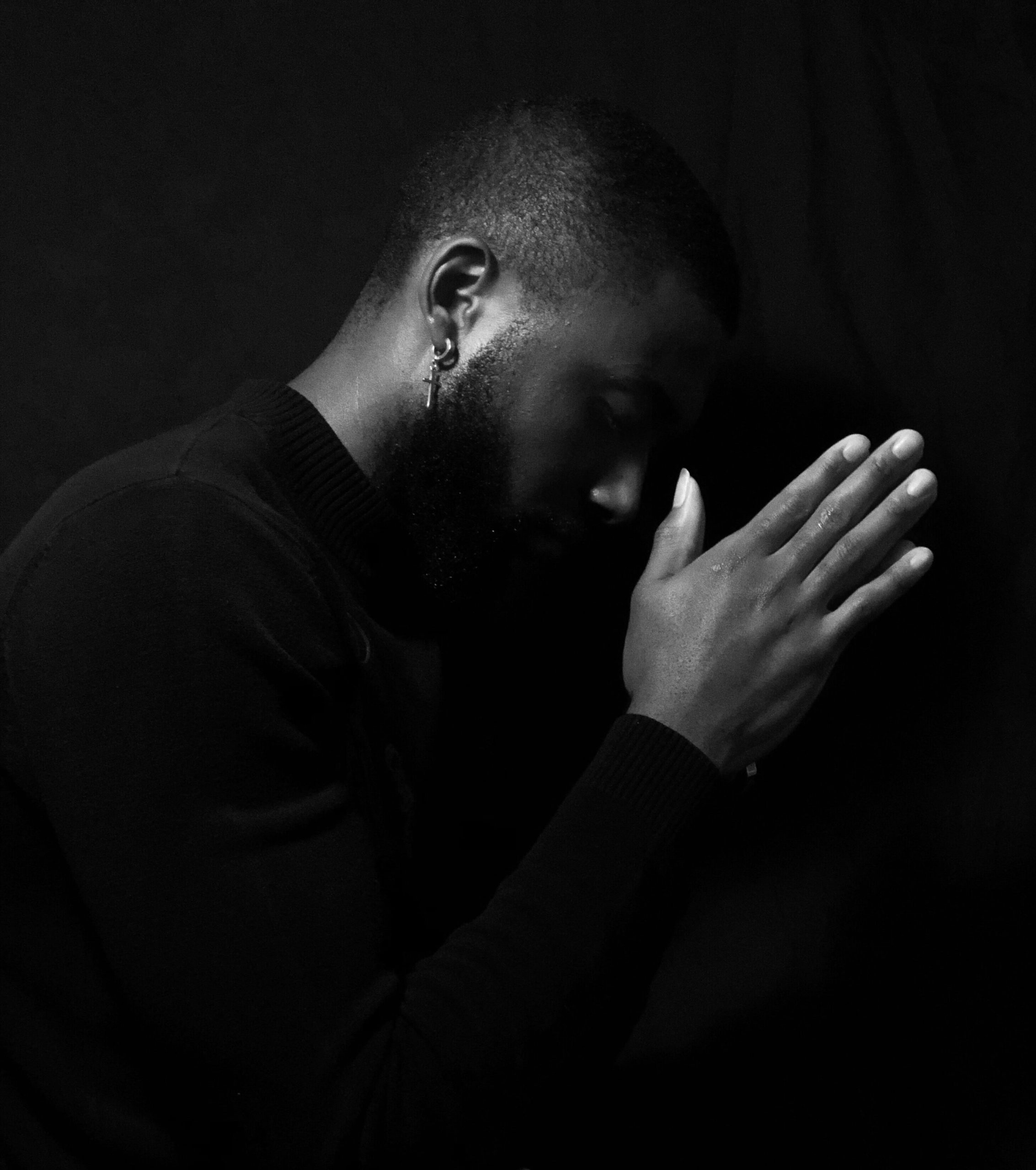 Photo of an African American man posing with his hands by his face. This photo represents how trauma can be impactful in someone's life and how trauma therapy in Macon, GA can help support you.