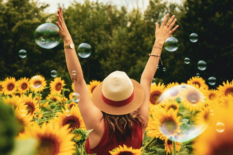 Photo of a woman standing in a sunflower field with her arms above her head. Do you struggle with past wounds? Discover how IFS therapy in Macon, GA can help you effectively overcome your wounds and begin healing.