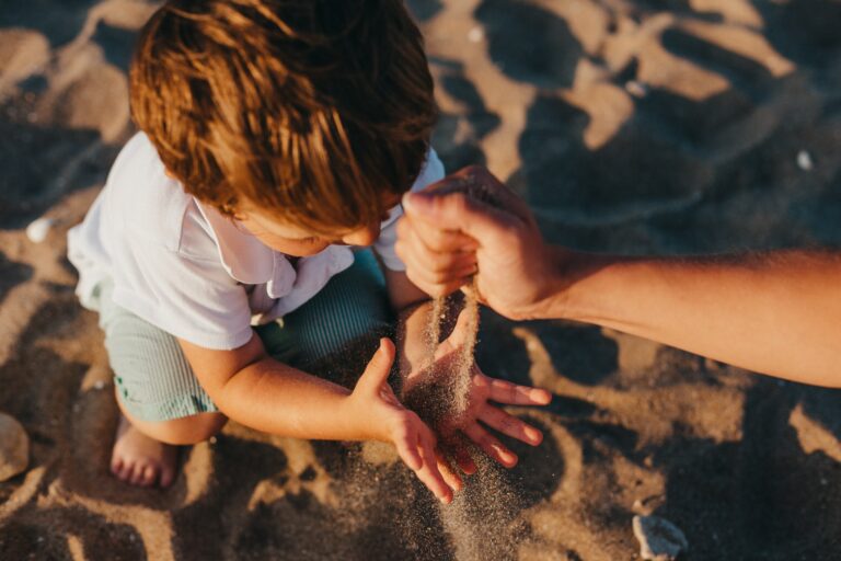 Photo of a young boy playing in sand. With the help of play therapy in Macon, GA you and your child can begin working on improving their emotions and behaviors. begin seeing positive results when working with a child therapist!